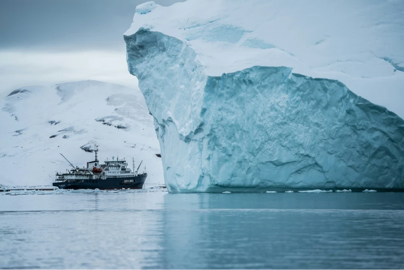 Ship beside an iceberg